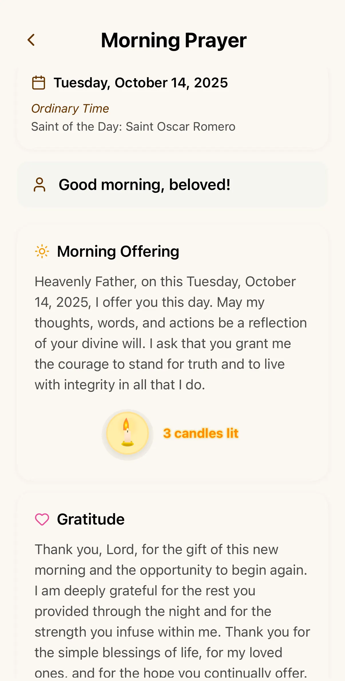 The Morning Prayer screen in FaithPal, with the saint of the day, the morning offering and three candles lit.